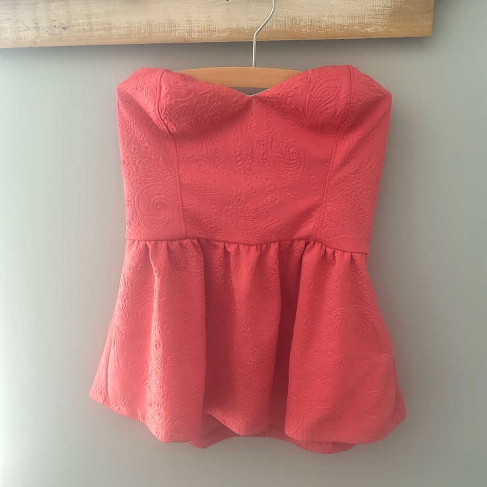Pink peplum strapless top